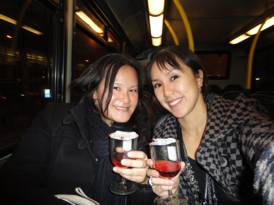 Girls drinking wine on a London bus